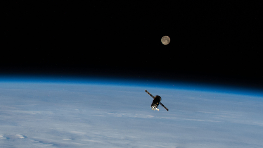 The ISS Progress 75 resupply ship is pictured with a Full Moon above the Earth’s horizon after undocking from the station. Credits: NASA