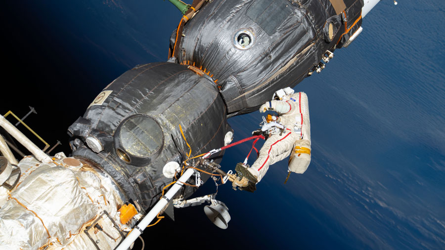 Cosmonaut Oleg Kononenko is pictured in an Orlan spacesuit with red stripes during a spacewalk in Dec. 11, 2018, to inspect the Soyuz MS-09 crew ship.