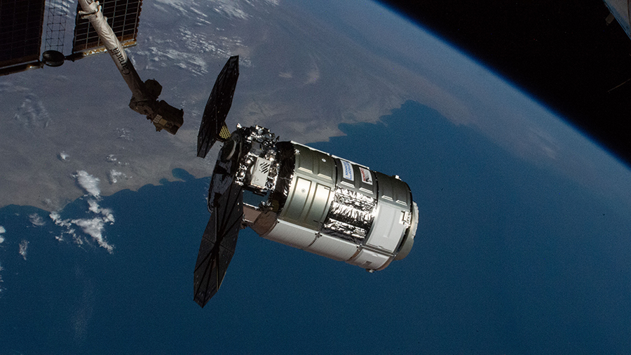 The Cygnus space freighter is pictured moments before its capture with the Canadarm2 robotic arm on Feb. 22, 2021.