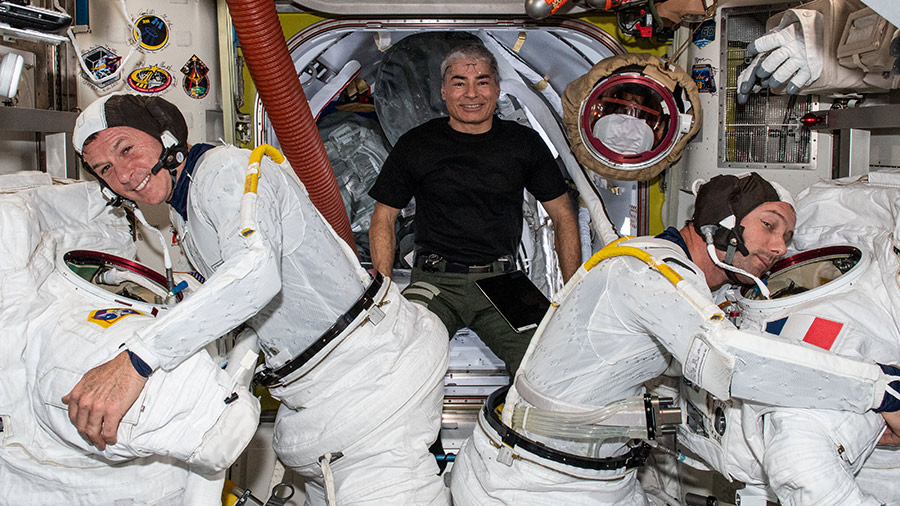 Astronaut Mark Vande Hei poses for a playful portrait with astronauts Shane Kimbrough (left) and Thomas Pesquet (right) who are trying on their U.S. spacesuits.