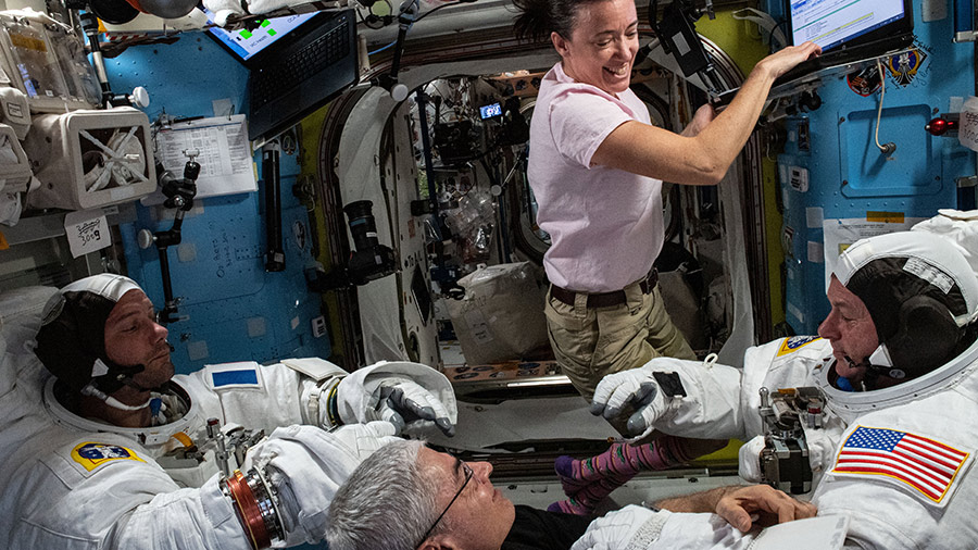 Expedition 65 Flight Engineers Megan McArthur and Mark Vande Hei support astronauts Thomas Pesquet (left) and Shane Kimbrough (right) as they test their U.S. spacesuits for a fit verification.