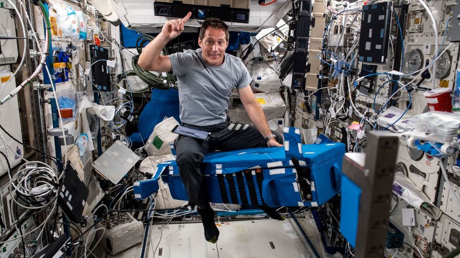 Expedition 65 Flight Engineer Thomas Pesquet of the European Space Agency is pictured inside the Columbus laboratory module setting up hardware for the GRIP experiment. 