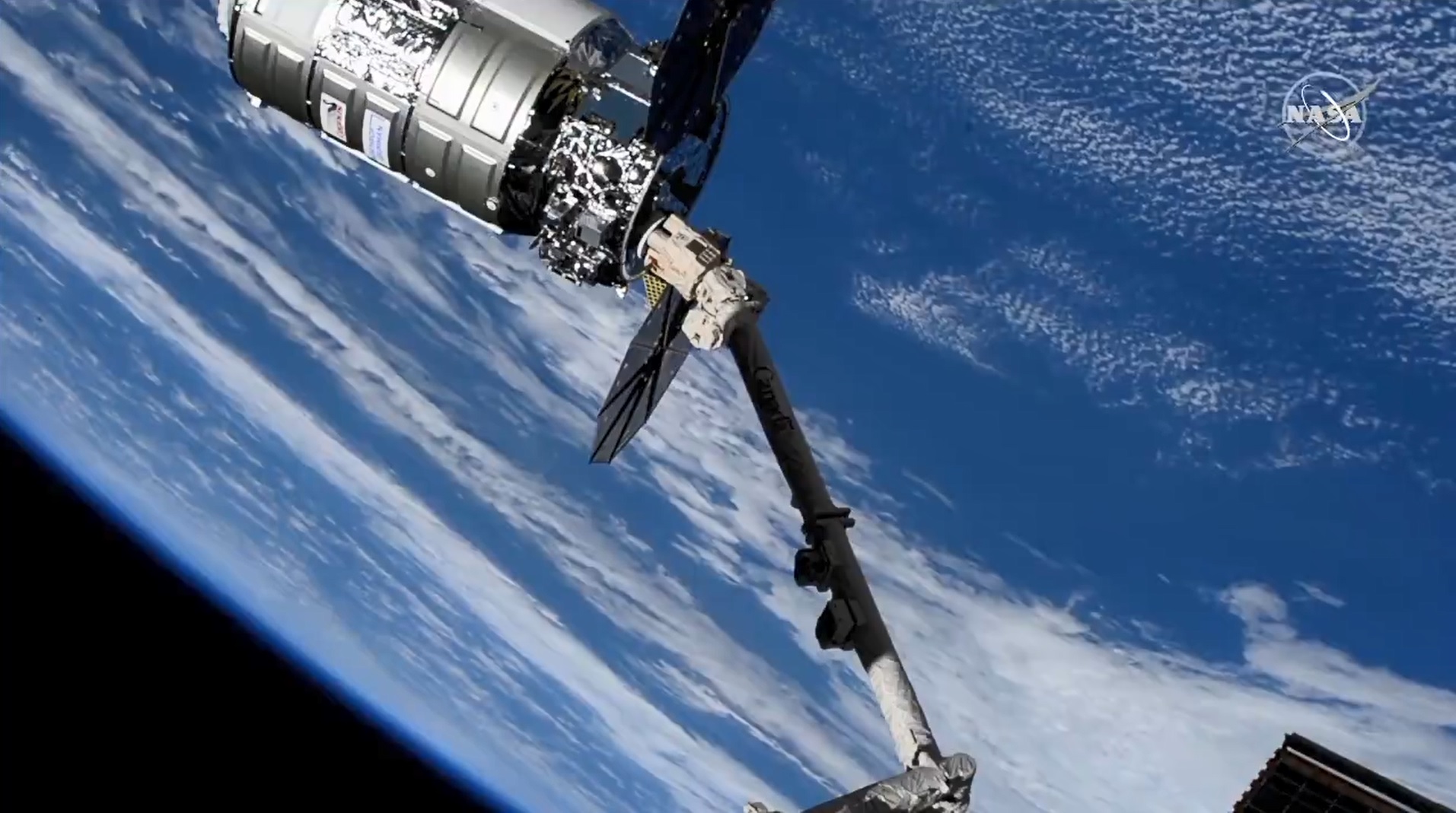 The Cygnus space freighter attached to the station robotic arm following a day-and-a-half trip after its launch from Virginia. Credit: NASA TV