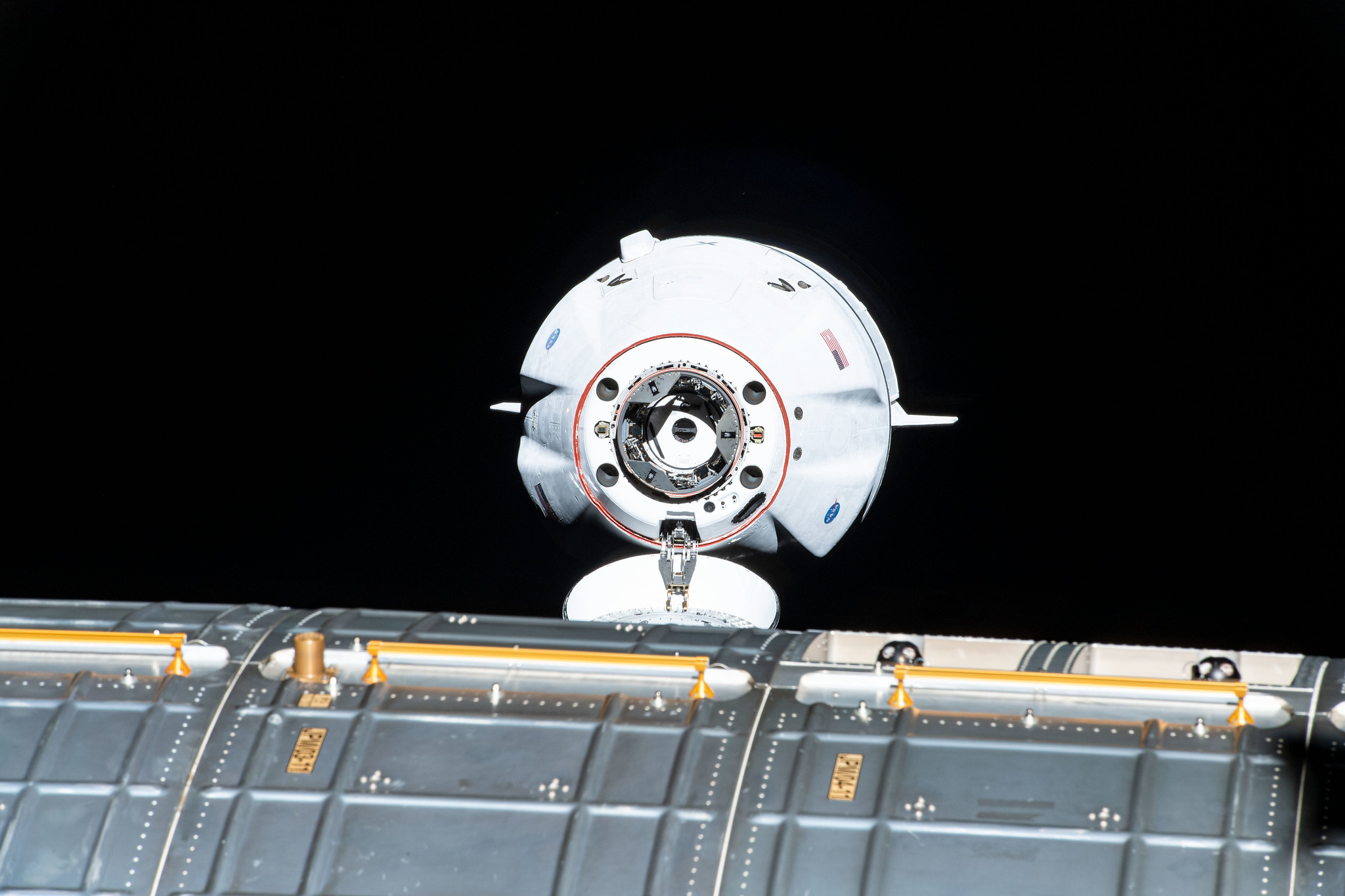 The SpaceX Cargo Dragon vehicle approaches the International Space Station for an autonomous docking to the Harmony module's forward international docking adapter