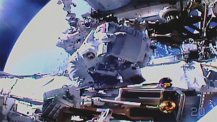 Spacewalker Akihiko Hoshide works on the station's Port-4 truss structure installing a modification kit and preparing it for a future Roll-Out Solar Array. Credit: NASA TV