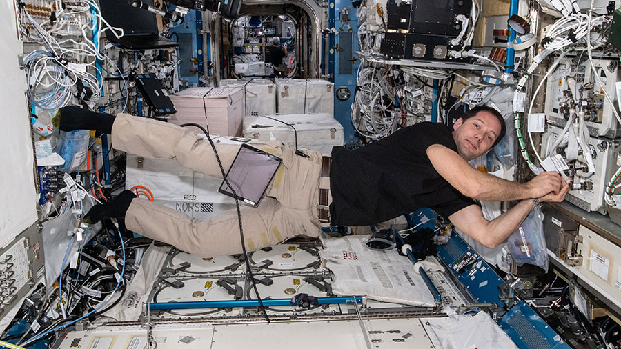 Expedition 65 Commander Thomas Pesquet installs fluid physics and materials research gear inside the Kibo laboratory module.