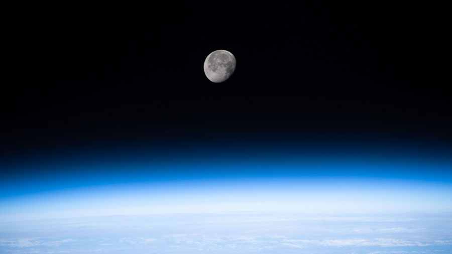 The waning gibbous Moon is pictured above the Earth's horizon as the International Space Station orbited 262 miles above eastern China.