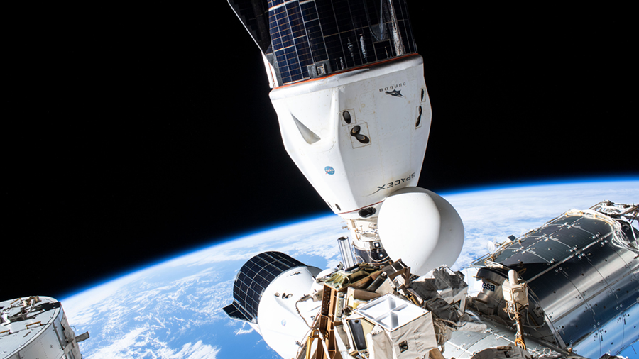 The SpaceX Cargo Dragon (top) and Crew Dragon vehicles are pictured on Sept. 12, 2021, docked to the station's Harmony module.