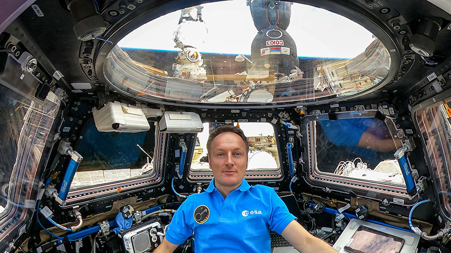 Expedition 66 Flight Engineer Matthias Maurer is pictured inside the seven-windowed cupola, the International Space Station's 