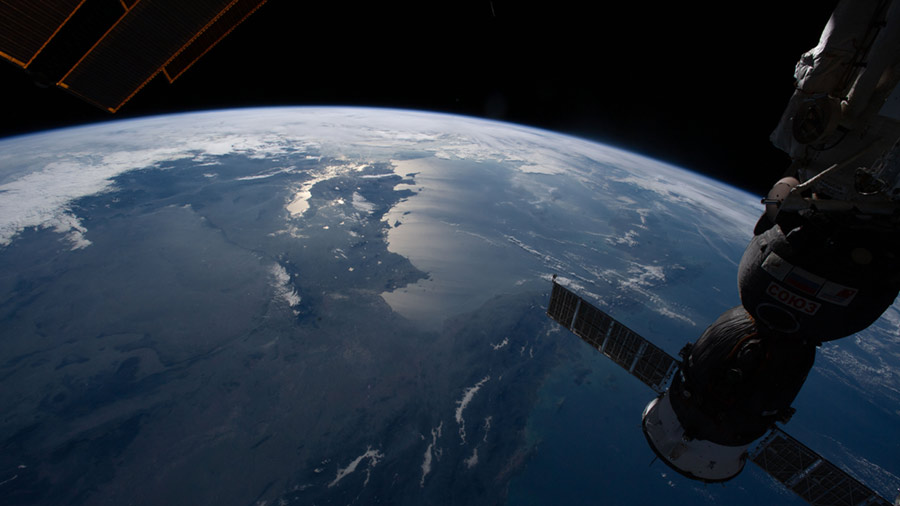 The Soyuz MS-19 crew ship is pictured docked to the Rassvet module as the International Space Station orbited 260 miles above southeast Asia.