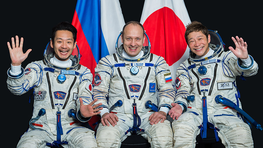 At center, Soyuz Commander Alexander Misurkin and spaceflight participants Yozo Hirano (left) and Yusaku Maezawa (right) pose for crew portrait.