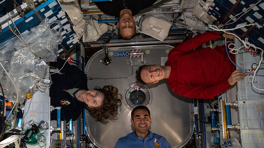 Clockwise from bottom, astronauts Raja Chari, Kayla Barron, Thomas Marshburn and Matthias Maurer are pictured during a playful portrait aboard the station.