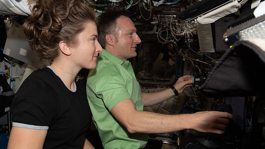 Astronauts Kayla Barron and Matthias Maurer participate in a robotics training session inside the U.S. Destiny laboratory module.