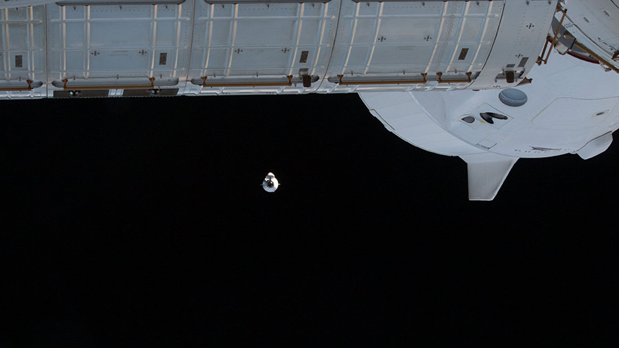 The SpaceX Cargo Dragon approaches the station on Dec. 22. The SpaceX Crew Dragon Endeavour can be seen docked to the Harmony module's forward port.