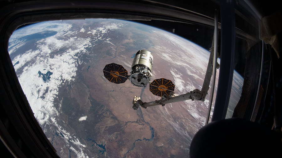 The Cygnus space freighter is pictured moments before its capture with the Canadarm2 robotic arm in February of 2021.