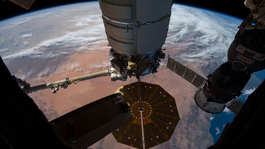 The Cygnus space freighter is pictured after its capture and installation to the space station's Unity module.