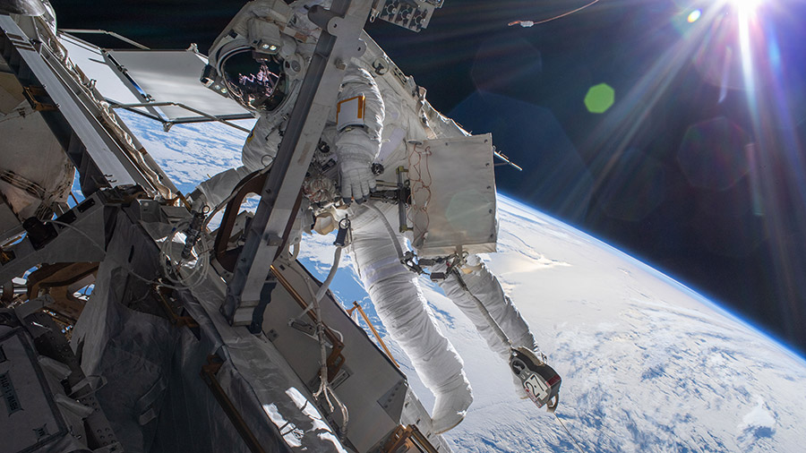 Astronaut Matthias Maurer is pictured during a spacewalk to install thermal gear and electronics components on the space station as it orbited 268 miles above the Pacific Ocean.