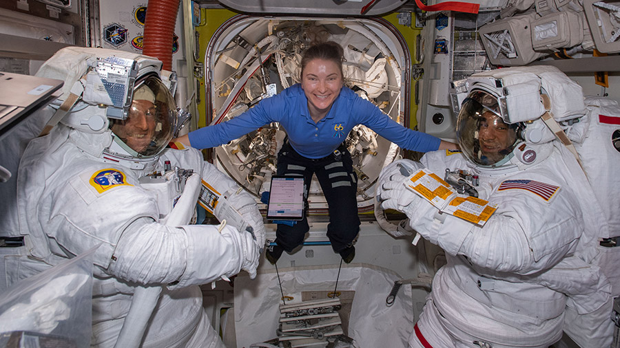 Astronaut Kayla Barron poses for a portrait with spacewalkers (from left) Matthias Maurer and Raja Chari before the beginning of Wednesday's spacewalk.