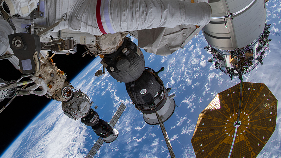 The Soyuz MS-19 crew ship is pictured between the Cygnus space freighter and the Soyuz MS-21 crew ship during a spacewalk on March 23, 2022.