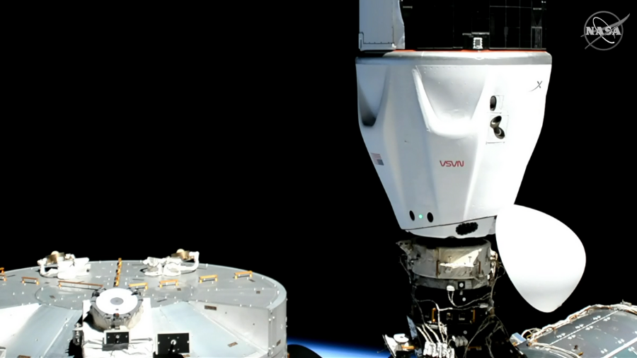 The SpaceX Dragon Freedom capsule is seen after docking to the International Space Station while the station was orbiting 261 statute miles above the Pacific Ocean.