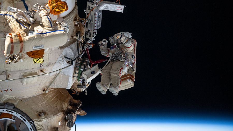 Roscosmos cosmonauts (from left) Denis Matveev and Oleg Artemyev are pictured during a spacewalk on April 18, 2022, to configure the European robotic arm.