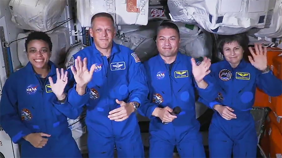 Astronauts (from left) Jessica Watkins, Bob Hines, Kjell Lindgren, and Samantha Cristoforetti wave following Starliner farewell remarks from NASA leadership on Tuesday. Credit: NASA TV