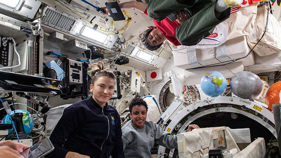 Expedition 67 Flight Engineers Kayla Barron and Jessica Watkins, both from NASA, and Samantha Cristoforetti from ESA (European Space Agency) are pictured check out systems inside the Kibo laboratory module.