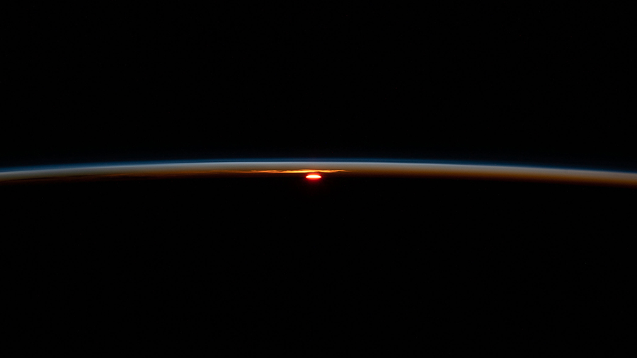 The International Space Station flies into an orbital sunset at an altitude of 266 miles above the Atlantic Ocean off the coast of South Africa.