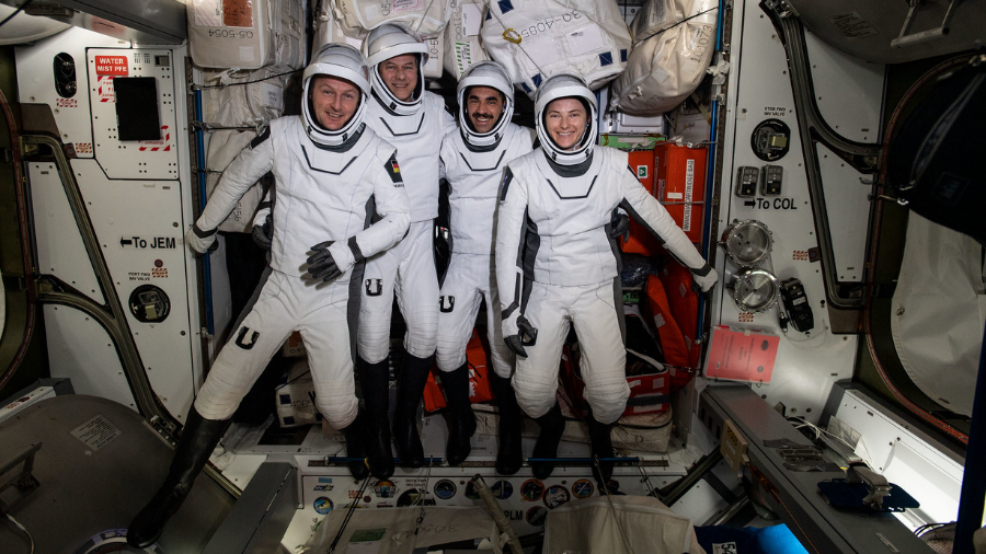 The four commercial crew astronauts representing the SpaceX Crew-3 mission are pictured in their Dragon spacesuits for a fit check aboard the International Space Station's Harmony module on April 21, 2022.