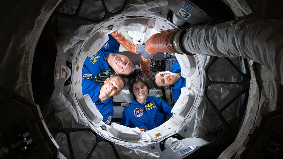 Expedition 67 astronauts (clockwise from bottom) Samantha Cristoforetti, Bob Hines, Kjell Lindgren, and Jessica Watkins, smile for a portrait from inside the Boeing Starliner vehicle on May 24, 2022.