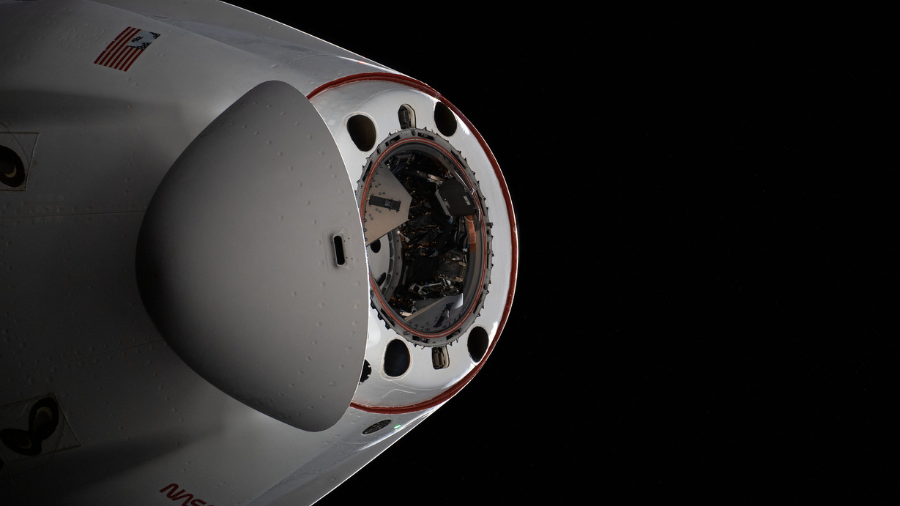 The pressurized capsule of the SpaceX Cargo Dragon resupply ship with its nose cone open is pictured as the vehicle departs the International Space Station on Jan. 23, 2022.