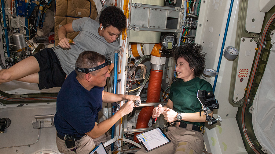 (Clockwise from top) Astronauts Jessica Watkins, Samantha Cristoforetti, and Bob Hines check thermal system components inside the Unity module.