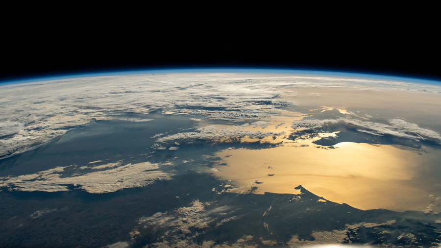 The sun's glint beams off the Caspian Sea in this photograph from the International Space Station as it was orbiting on a southwest to northeast trek 262 miles above Turkey near the Black Sea coast on June 24, 2022.