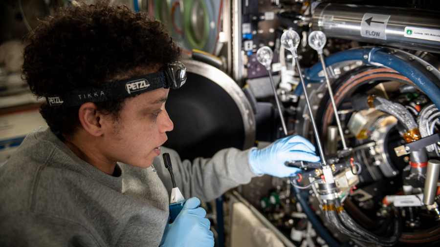 Expedition 67 Flight Engineer and NASA astronaut Jessica Watkins services components that support the Solid Fuel Ignition and Extinction (SOFIE) fire safety experiment inside the International Space Station's Combustion Integrated Rack on June 24, 2022.