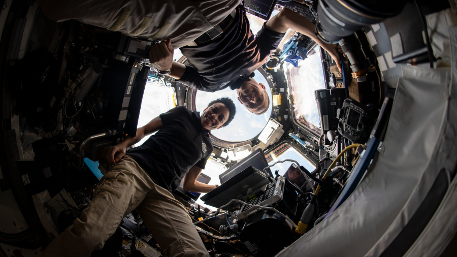 NASA astronauts Bob Hines and Jessica Watkins are pictured inside the cupola, the International Space Station's "window to the world," after monitoring the successful rendezvous and docking of the SpaceX Dragon space freighter on its 25th Commercial Resupply Services mission on July 16, 2022.