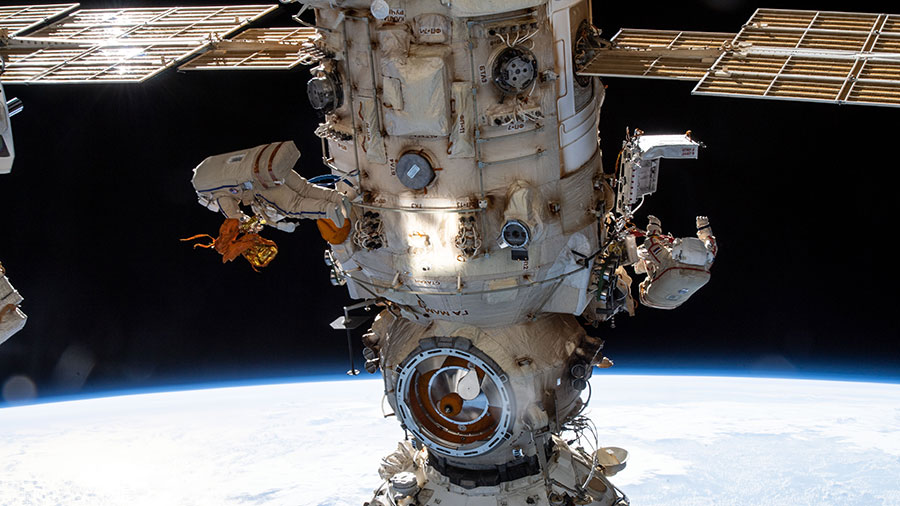 Spacewalkers (from left) Denis Matveev and Oleg Artemyev configure the European robotic arm on the Nauka multipurpose laboratory module on April 18, 2022.