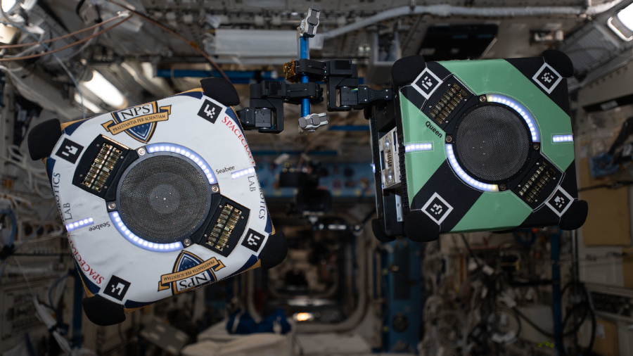 The free-floating Astrobee robots perform flight maneuvers with support from university ground teams and the astronauts aboard the space station on December 9, 2021. Credit: ESA/NASA