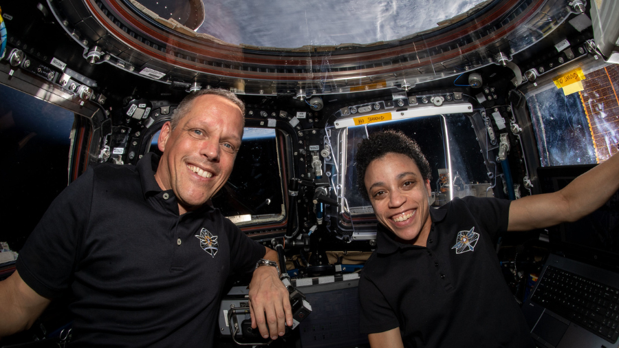 NASA astronauts Bob Hines and Jessica Watkins are pictured inside the cupola, the International Space Station's 