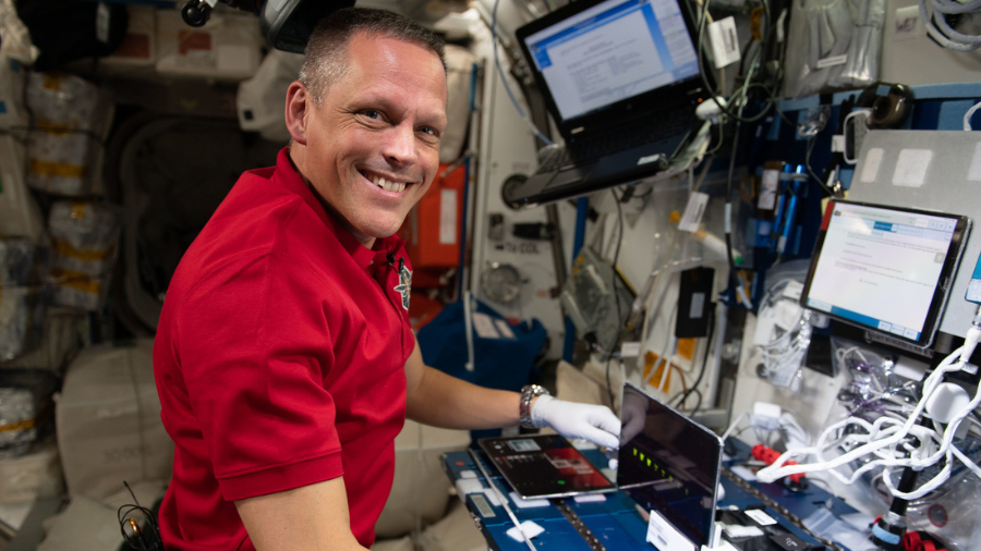 NASA astronaut Bob Hines is shown performing Genes in Space-9 aboard the International Space Station on July 21, 2022.