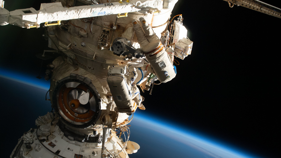 Spacewalkers Samantha Cristoforetti of ESA (European Space Agency) and Oleg Artemyev of Roscosmos work outside the Nauka multipurpose laboratory module on the International Space Station while wearing Russian Orlan spacesuits. The duo continued outfitting the European Robotic Arm attached to Nauka during a spacewalk that lasted seven hours and five minutes on July 21, 2022.