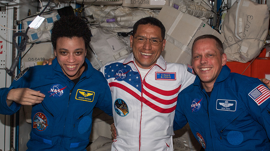 New station Flight Engineer Frank Rubio (center) of NASA is greeted by fellow NASA astronauts Jessica Watkins and Bob Hines shortly after arriving at the orbital lab on Sept. 21, 2022.