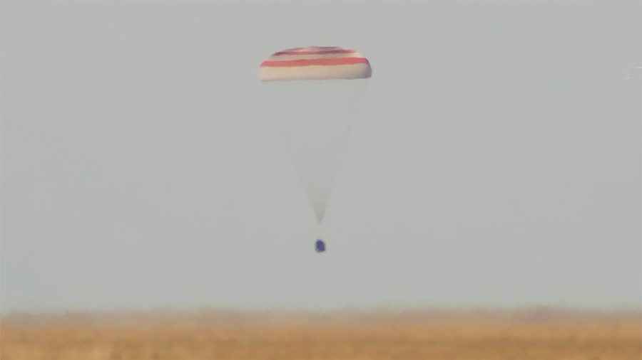 The Soyuz MS-21 crew ship with three cosmonauts aboard is seen parachuting to a landing in Kazakhstan less than three-and-a-half hours after undocking from the space station. Credit: NASA TV