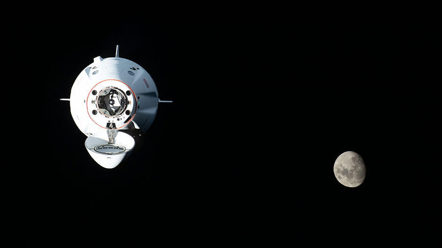 The SpaceX Dragon Endurance crew ship, carrying four Crew-5 members, approaches the station with the waxing gibbous Moon in the background. Credit: NASA/Kjell Lindgren