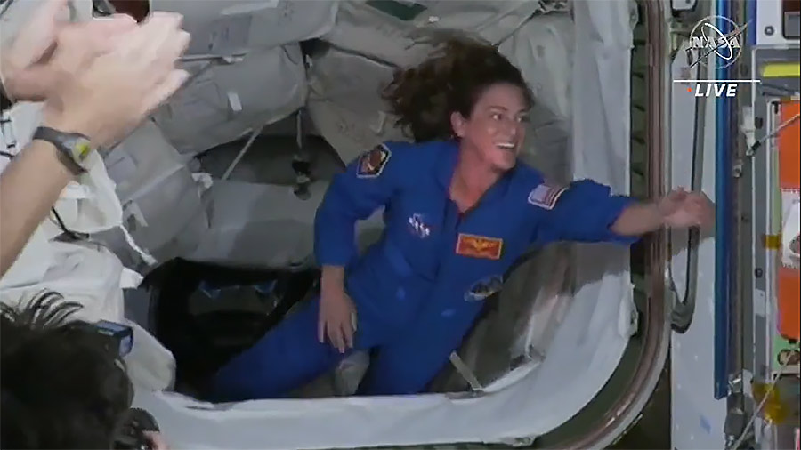 NASA astronaut Nicole Mann enters the space station less than two hours after docking the Dragon Endurance crew ship to the Harmony module's forward port.