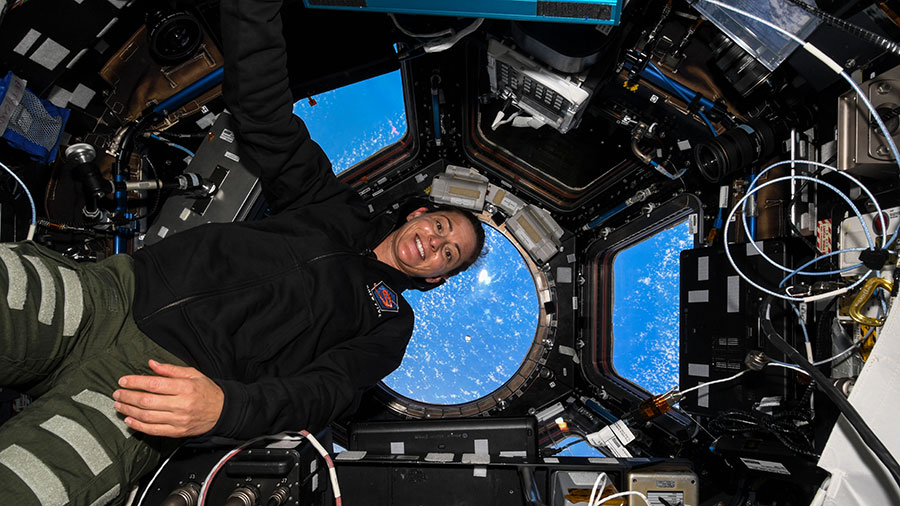 Astronaut Nicole Mann is pictured inside the seven-window cupola as the SpaceX Dragon cargo craft approaches the space station on Nov. 27, 2022.