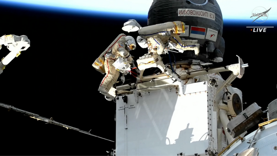 Cosmonauts Sergey Prokopyev and Dmitri Petelin work on the outside of the Rassvet module on Nov. 17, 2022, during the first of four Russian maintenance spacewalks planned before the end of the year. Credit: NASA TV