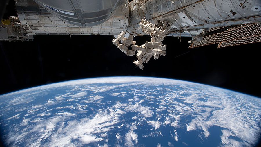 The space station's fine-tuned robotic hand, also known as Dextre, is pictured attached to the U.S. Destiny laboratory module as the orbiting lab flew 270 miles above the southern Pacific Ocean.