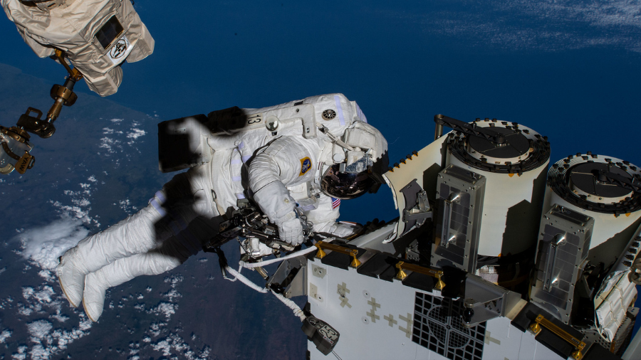 Expedition 68 Flight Engineer and NASA astronaut Josh Cassada prepares a roll-out solar array for deployment during a spacewalk on Dec. 22, 2022.