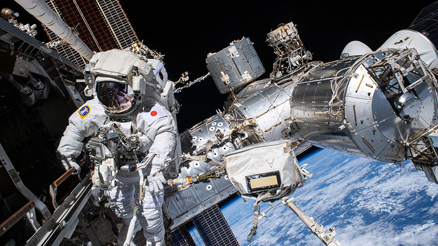 Astronaut Koichi Wakata is pictured during his second spacewalk on Feb. 2, 2023, installing hardware to enable the future installation of the orbiting lab's next roll-out solar array.