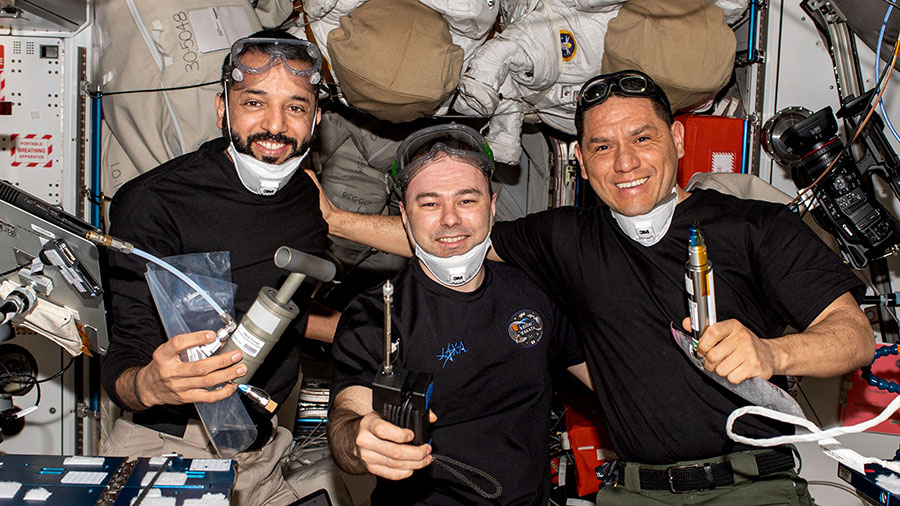 Expedition 69 Flight Engineers (from left) Sultan Alneyadi, Dmitri Petelin, and Frank Rubio pose for a portrait after the arrival of the SpaceX Dragon cargo vehicle on June 6.